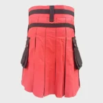 Red kilt with black accents, pockets, and pleats, crafted from durable fabric suitable for traditional Scottish attire and casual wear, showcasing Highland heritage.